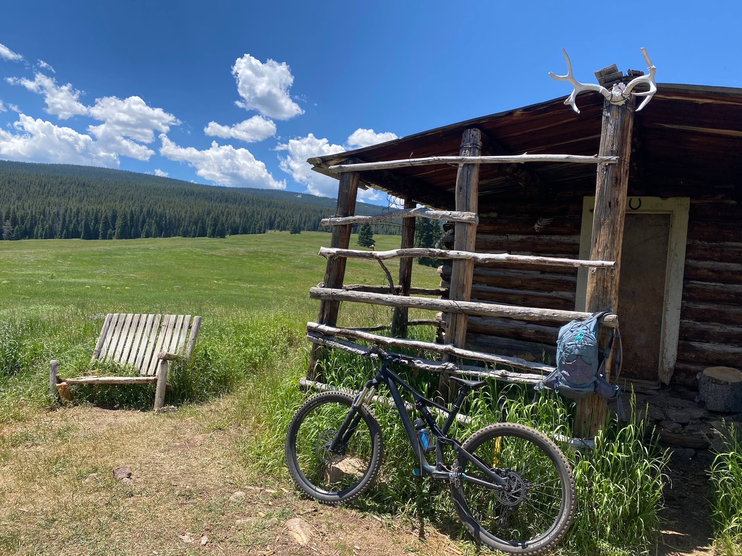 bicycle by cabin in the mountains